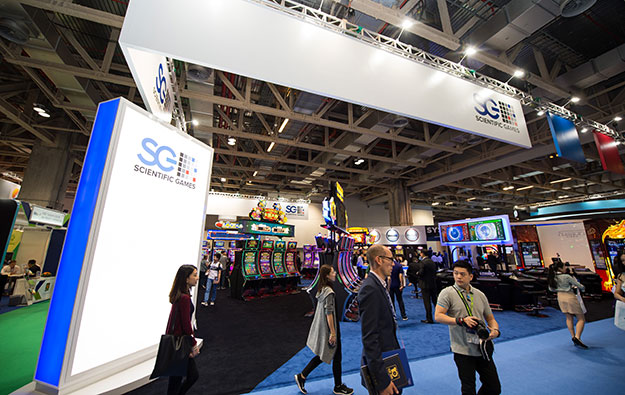 Sci Games slims 3Q loss, heralds new cuts on costs