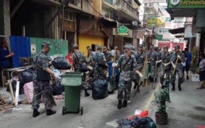 Chinese military joins Macau typhoon clean up