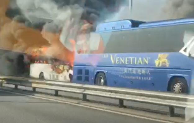 Shuttle-type buses collide, burn on Macau bridge: police